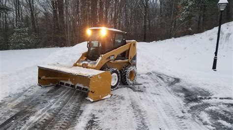 driving in snow steer into skid|driving a skid steer loader.